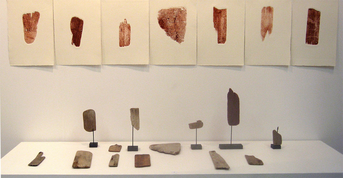 Installation of found wooden objects, unique state prints on paper, wire and charcoal, approximately 70 x 200 x 50 cm, 2013.